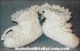 White ruffled top newborn booties